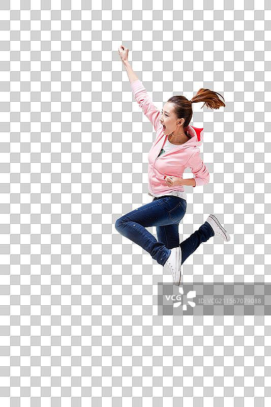 快乐的年轻女人跳跃图片素材