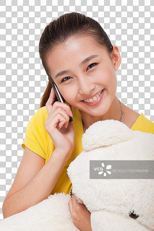 年轻女人抱着玩具熊图片素材