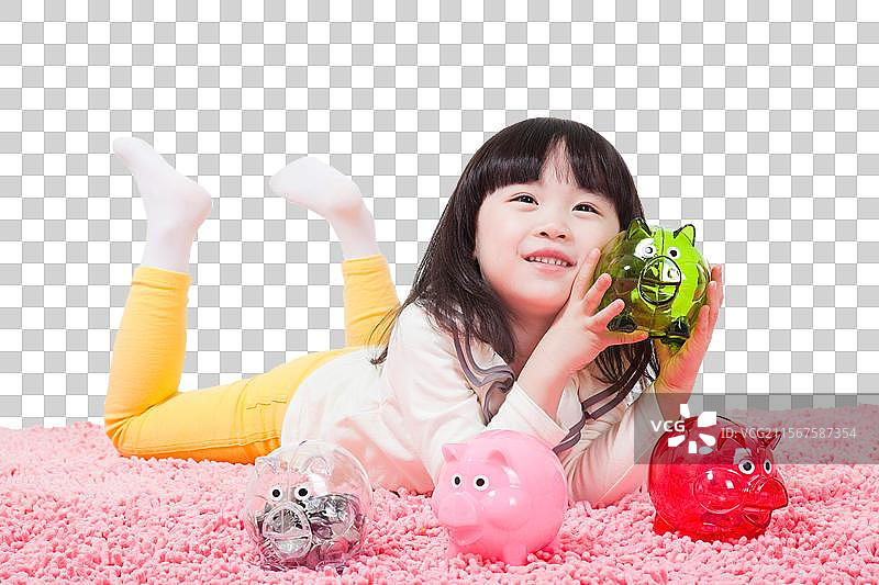 可爱的小女孩和小猪存钱罐图片素材