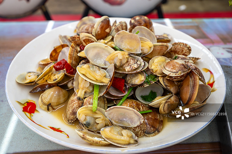 青岛特色美食 辣炒蛤蜊图片素材