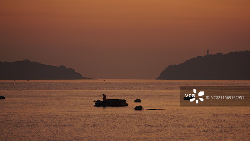 橘色天空下的海景图片素材