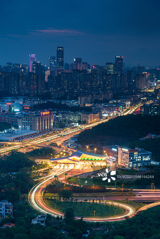 广州番禺南大干线南村收费站与高楼大厦建筑夜景图片素材