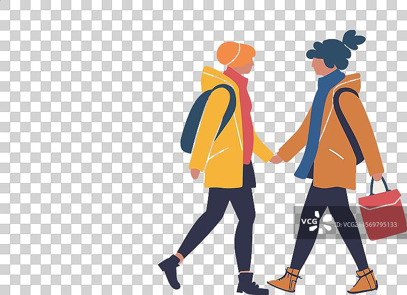 两个人手牵手随意地走在一起图片素材