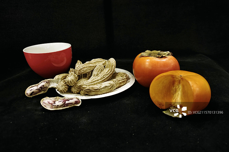 手机静物食品柿子花生特写图片素材