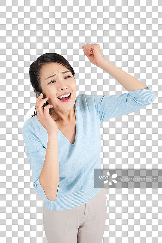 棚拍休闲装年轻女人打电话图片素材