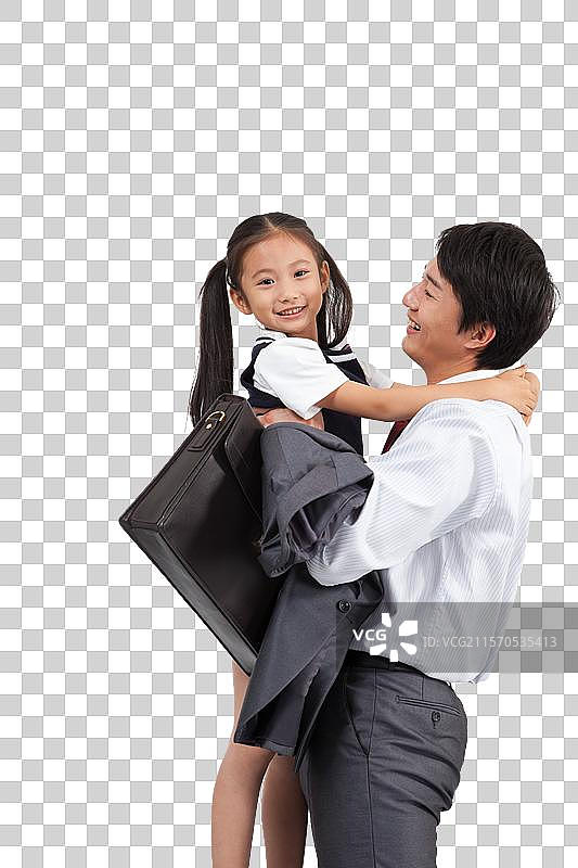 棚拍商务装年轻父亲抱着穿裙子的小女孩图片素材