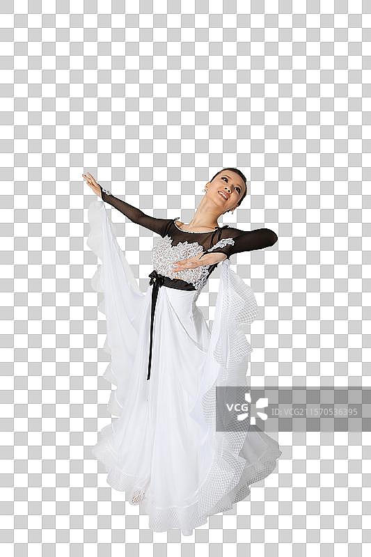 棚拍年轻女演员跳国标舞图片素材