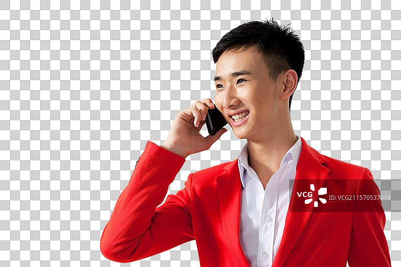 棚拍穿红色西装的年轻男人打手机图片素材