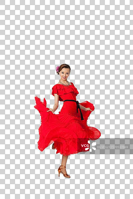棚拍穿红色连衣裙跳舞的年轻女人图片素材
