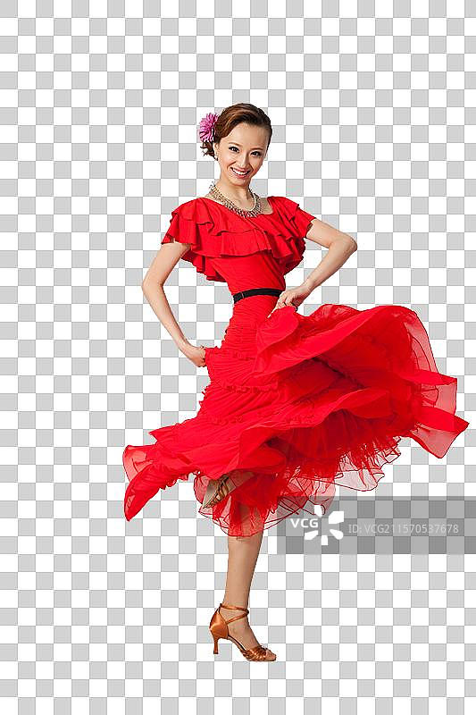 棚拍穿红色连衣裙跳舞的年轻女人图片素材