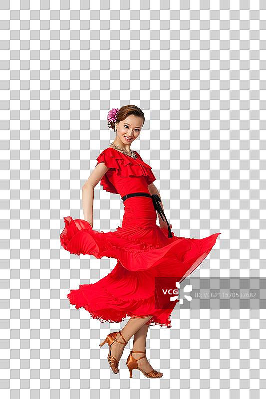棚拍穿红色连衣裙跳舞的年轻女人图片素材
