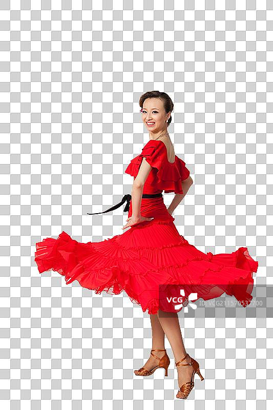 棚拍穿红色连衣裙跳舞的年轻女人图片素材