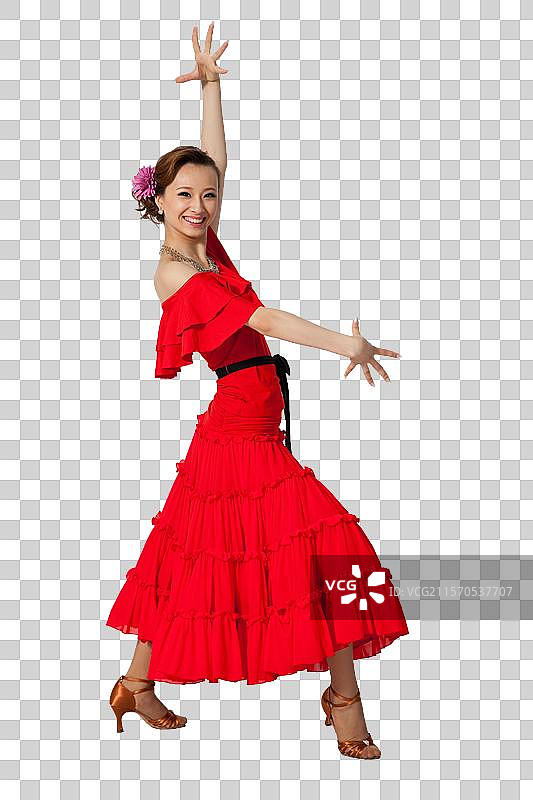 棚拍穿红色连衣裙跳舞的年轻女人图片素材