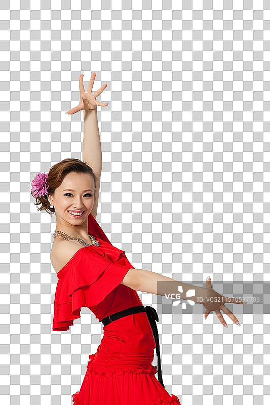棚拍穿红色连衣裙跳舞的年轻女人图片素材