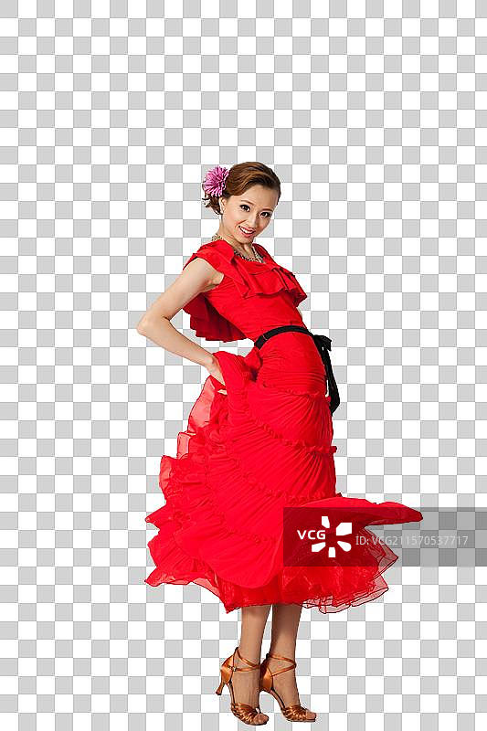 棚拍穿红色连衣裙跳舞的年轻女人图片素材
