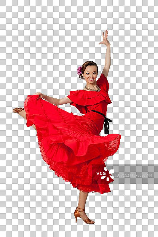 棚拍穿红色连衣裙跳舞的年轻女人图片素材