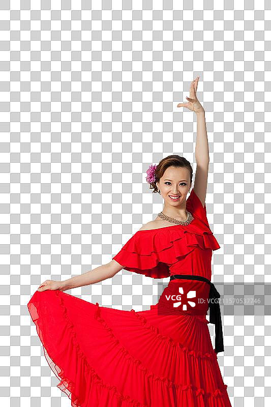 棚拍穿红色连衣裙跳舞的年轻女人图片素材