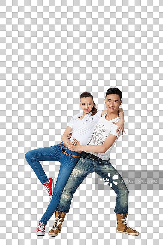 棚拍穿休闲装的年轻情侣跳舞图片素材