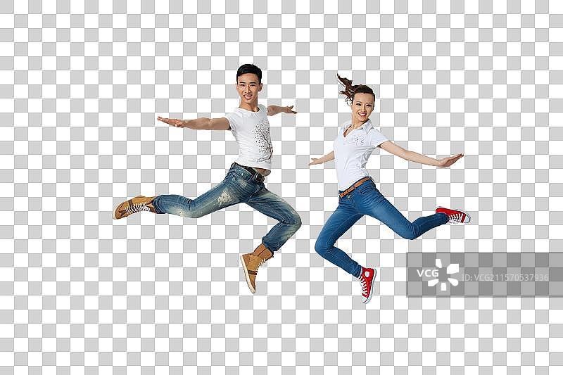 棚拍年轻情侣跳跃图片素材