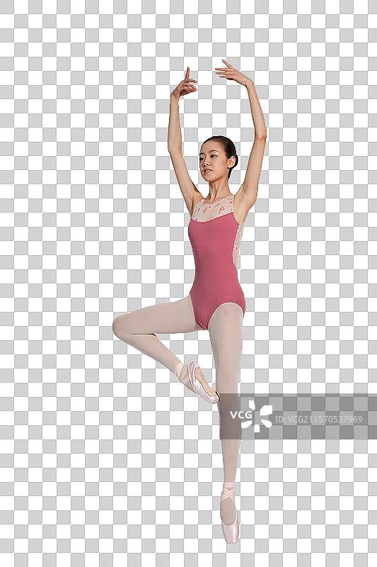 棚拍年轻的芭蕾舞女演员练习基本功图片素材
