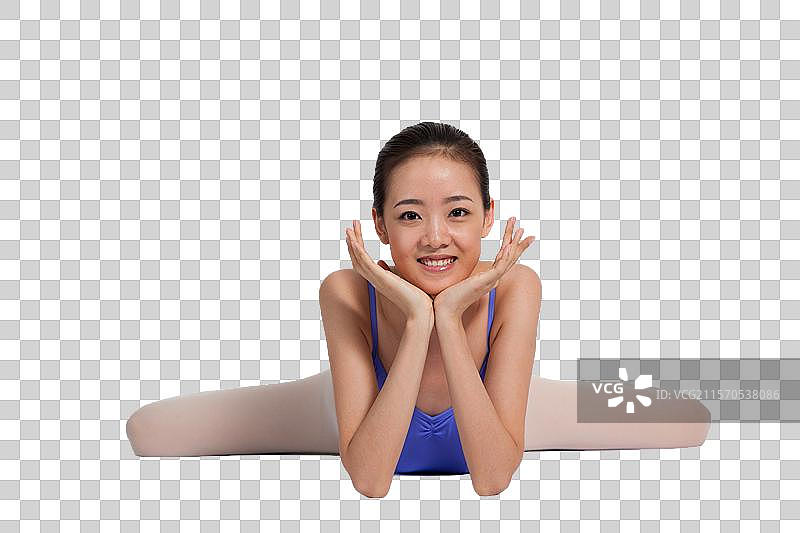 棚拍年轻的芭蕾舞女演员练习基本功图片素材