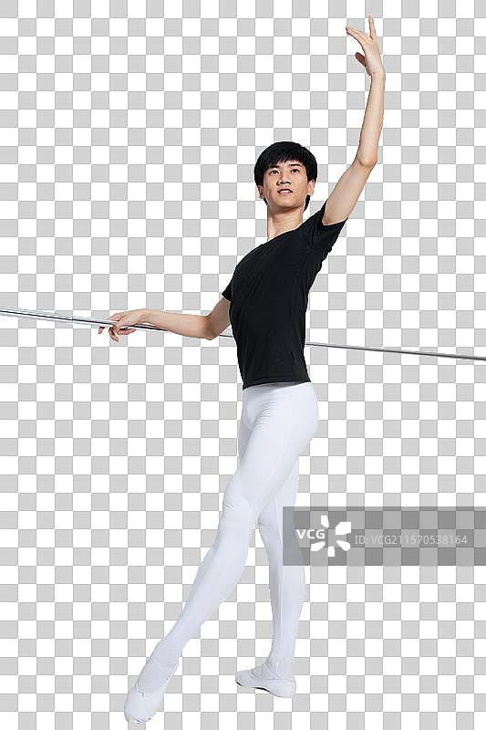 棚拍年轻的芭蕾舞男演员练习基本功图片素材