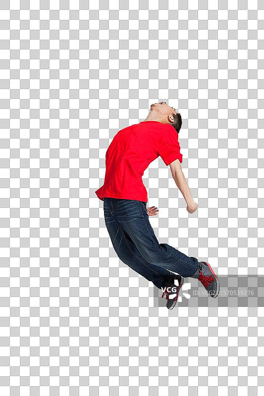 棚拍年轻男人跳跃图片素材