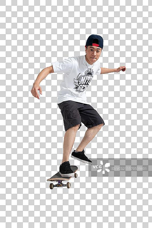 棚拍年轻男人玩滑板图片素材