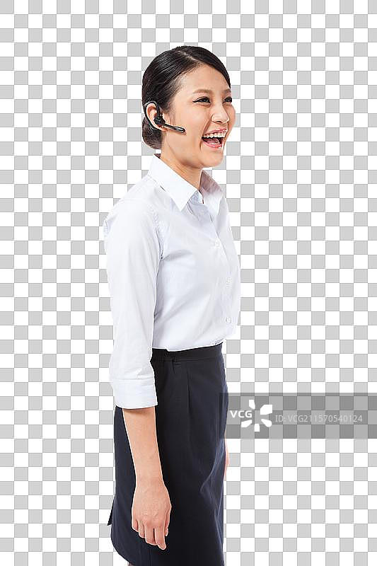 棚拍戴蓝牙耳机的年轻商务女士图片素材