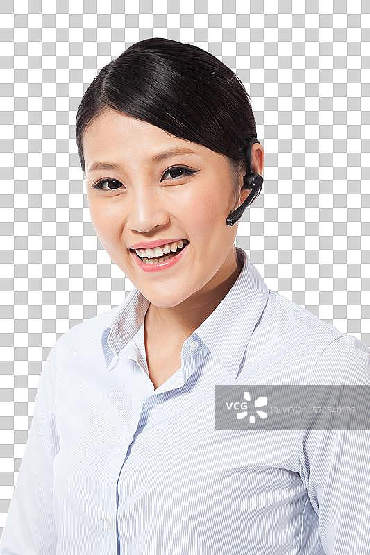 棚拍戴蓝牙耳机的年轻商务女士图片素材