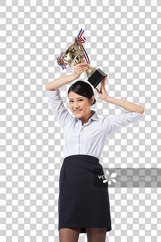 棚拍年轻商务女士拿着奖杯图片素材
