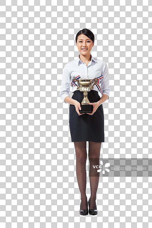 棚拍年轻商务女士拿着奖杯图片素材