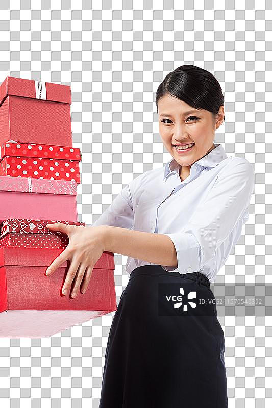 棚拍年轻商务女士抱着礼物盒图片素材