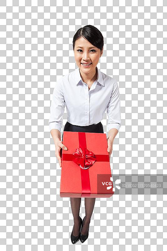 棚拍年轻商务女士抱着礼物盒图片素材