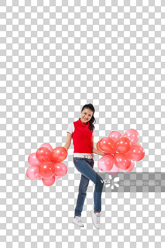 棚拍年轻女人举着红色气球图片素材