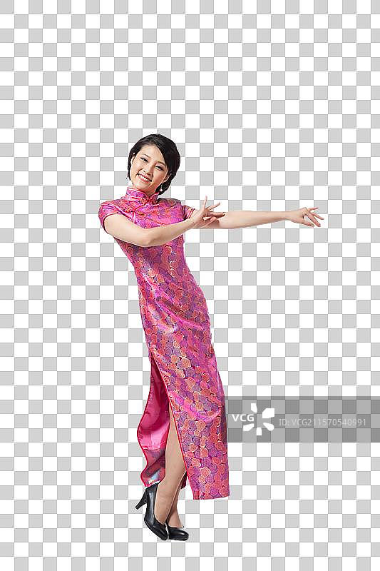 棚拍穿旗袍的年轻女人图片素材