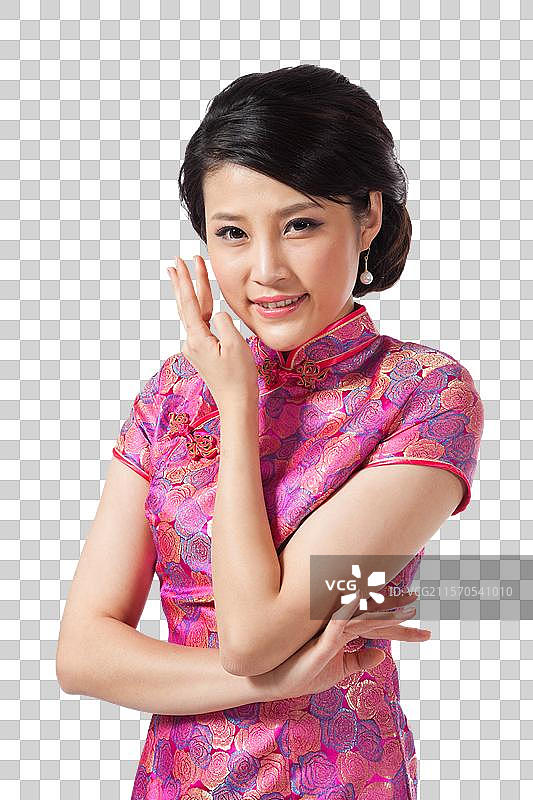 棚拍穿旗袍的年轻女人图片素材