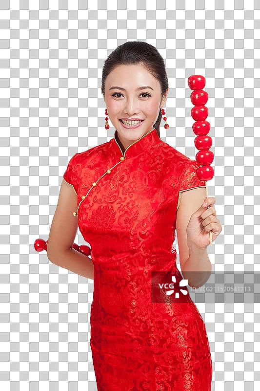 棚拍身穿中国传统服装的年轻女人和糖葫芦图片素材