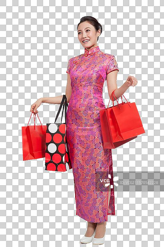 棚拍身穿中国传统服装的年轻女人购物图片素材