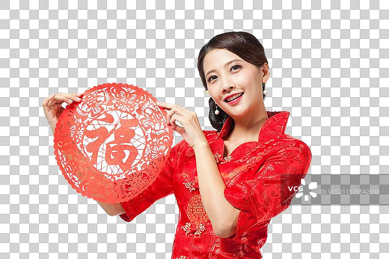 棚拍身穿中国传统服装的年轻女人和剪纸福字图片素材