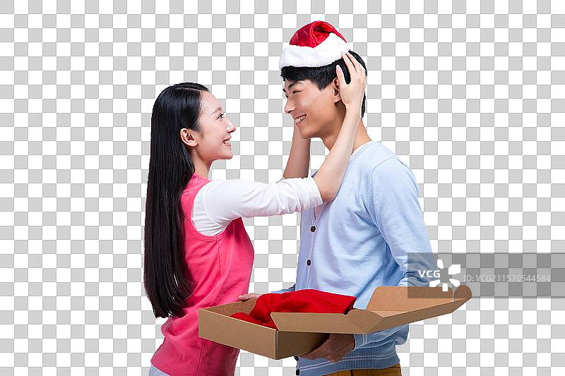 棚拍年轻情侣试穿购物商品图片素材