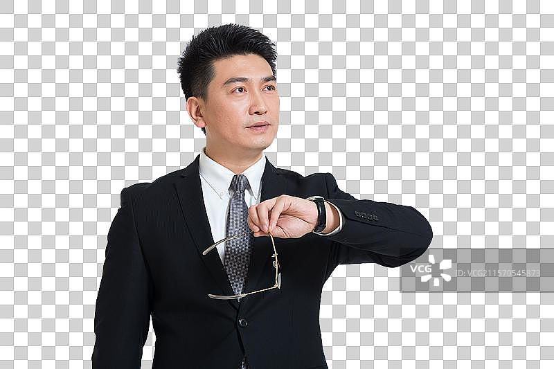 棚拍中年商务男士看手表图片素材