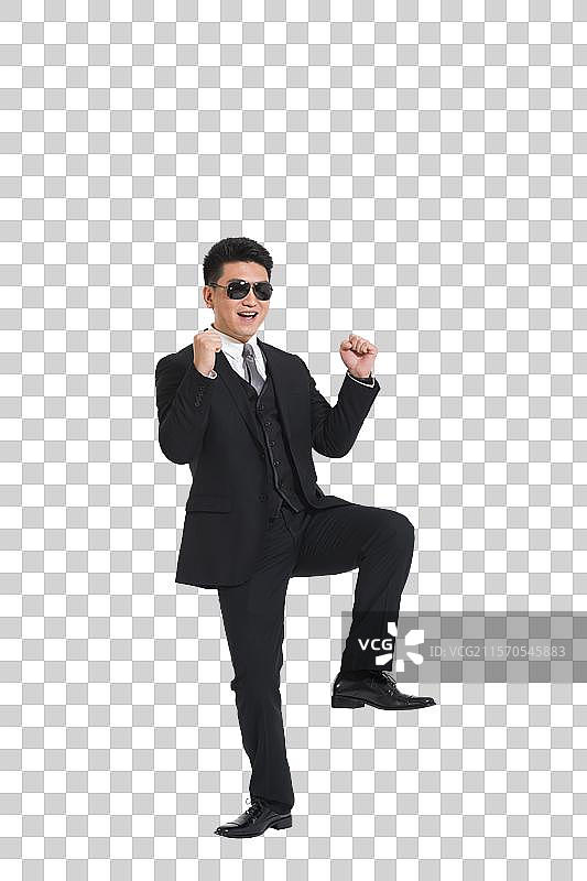 棚拍中年商务男士跳骑马舞图片素材