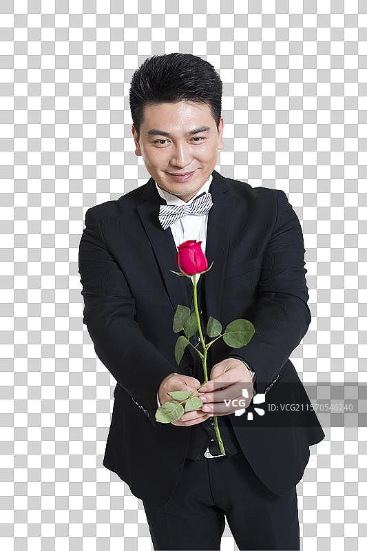 棚拍中年商务男士拿着一支玫瑰花图片素材