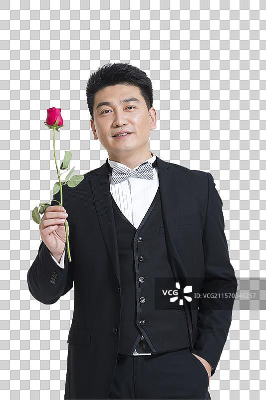 棚拍中年商务男士拿着一支玫瑰花图片素材