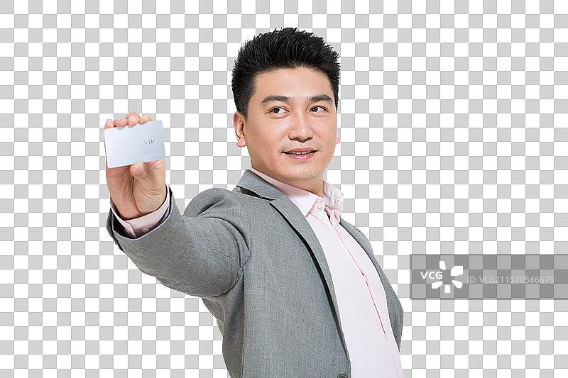棚拍中年商务男士展示银行卡图片素材