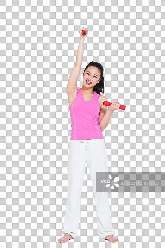 棚拍年轻女人举哑铃图片素材