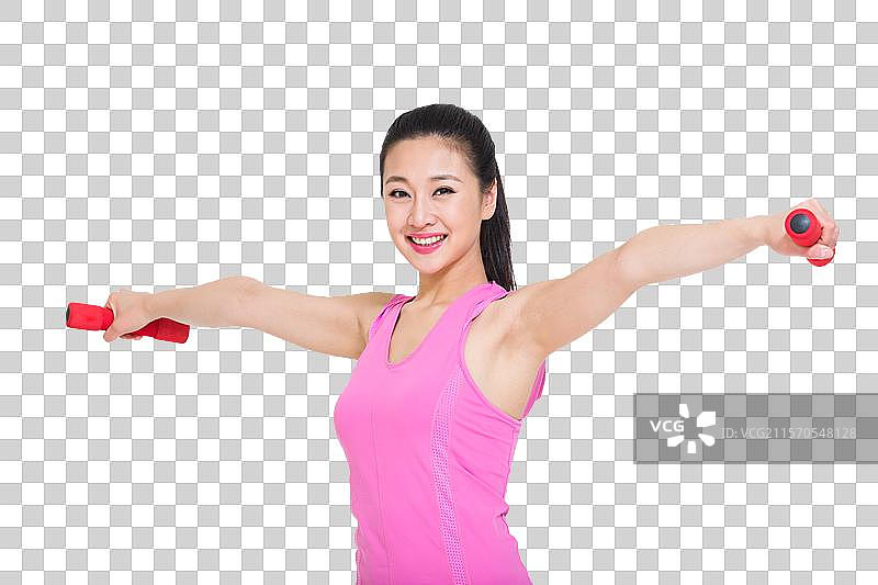 棚拍年轻女人举哑铃图片素材