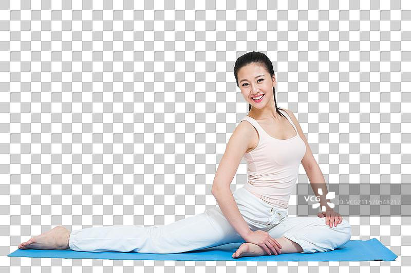 棚拍年轻女人做瑜伽图片素材