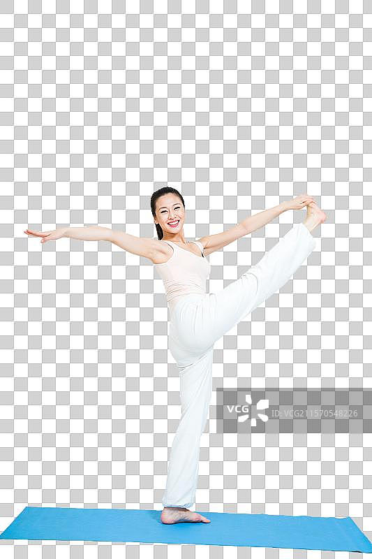 棚拍年轻女人做瑜伽图片素材